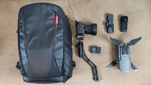 PGYTech Camera Bag and a Sony Mirrorless Camera, a Gopro, A osmo pocket, and a insta360 Camera.